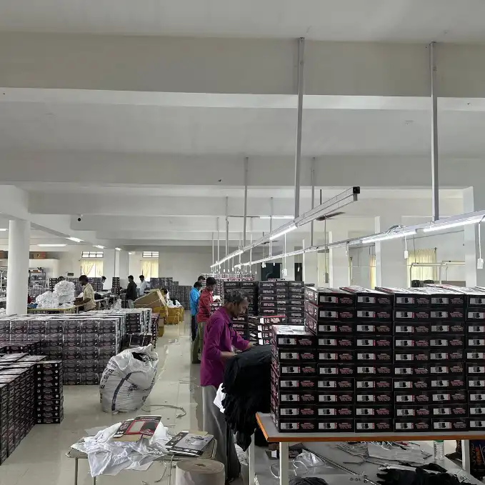 Workers inspecting and stacking finished executive corporate gift boxes in packing area