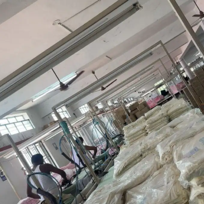 Steam pressing and quality finishing line for packed corporate uniform and apparel kits