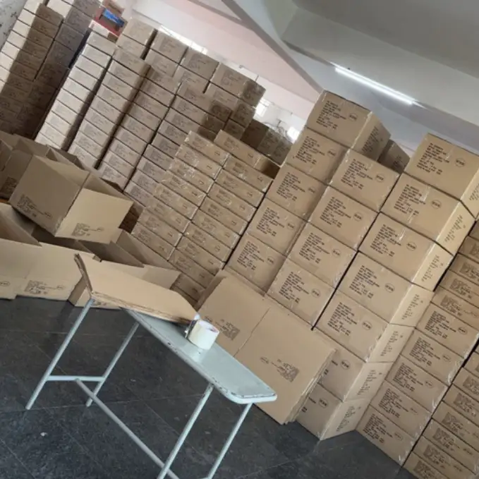 Massive stack of master carton boxes packed for bulk corporate gifting orders in warehouse