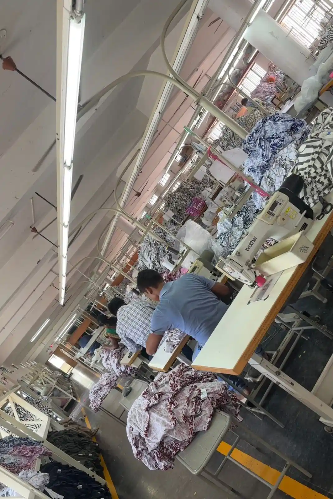 Brother industrial sewing machines processing patterned textile fabric for luxury corporate gift kits