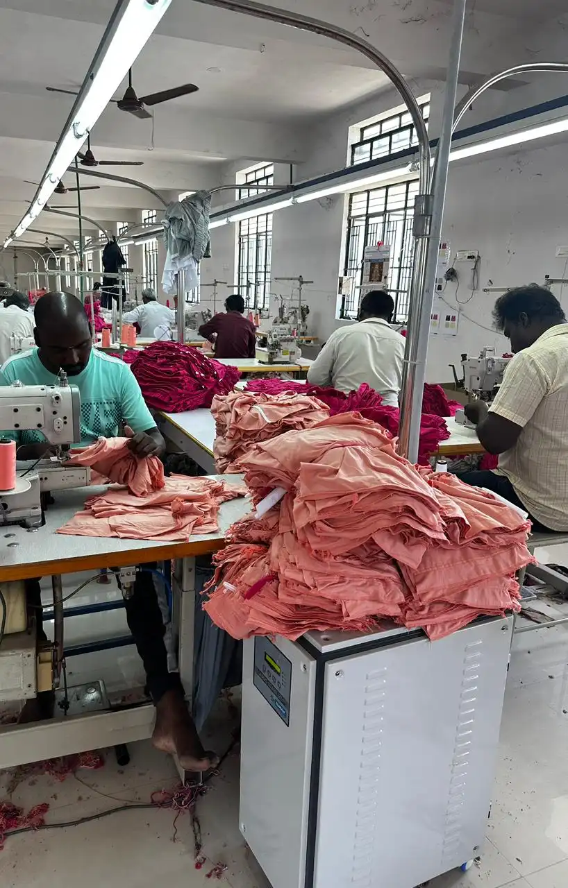 In-house production line assembling custom t-shirts and apparel for corporate client hampers